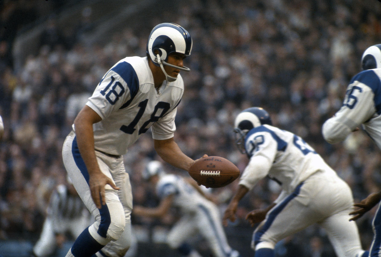 UNSPECIFIED - CIRCA 1970:  Roman Gabriel #18 of the Los Angeles Rams turns to hand the ball off to a running back during an NFL football game circa 1969. Gabriel played for the Rams from 1962-72. (Photo by Focus on Sport/Getty Images) 