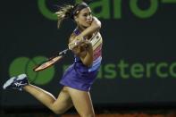 Mar 23, 2018; Key Biscayne, FL, USA; Monica Puig of Puerto Rico hits a backhand against Caroline Wozniacki of Denmark (not pictured) on day four of the Miami Open at Tennis Center at Crandon Park. Mandatory Credit: Geoff Burke-USA TODAY Sports