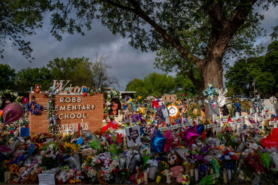 Image: A memorial for the 19 children and two teachers who were killed at Robb Elementary School in Uvalde, Texas, on June 1, 2022. (Brandon Bell / Getty Images file)