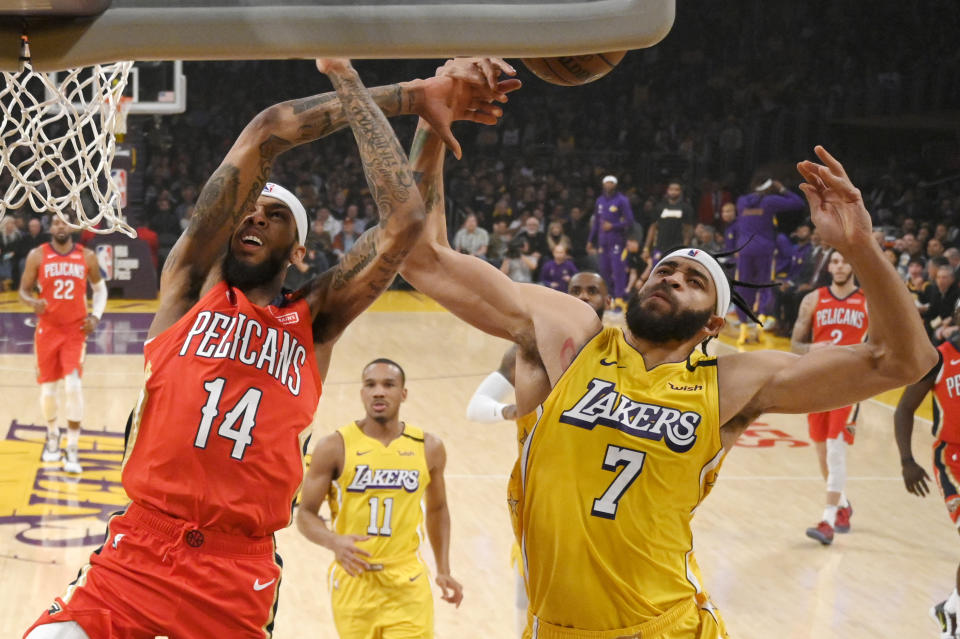 New Orleans Pelicans forward Brandon Ingram, left, is fouled while shooting by Los Angeles Lakers center JaVale McGee during the first half of an NBA basketball game Friday, Jan. 3, 2020, in Los Angeles. (AP Photo/Mark J. Terrill)