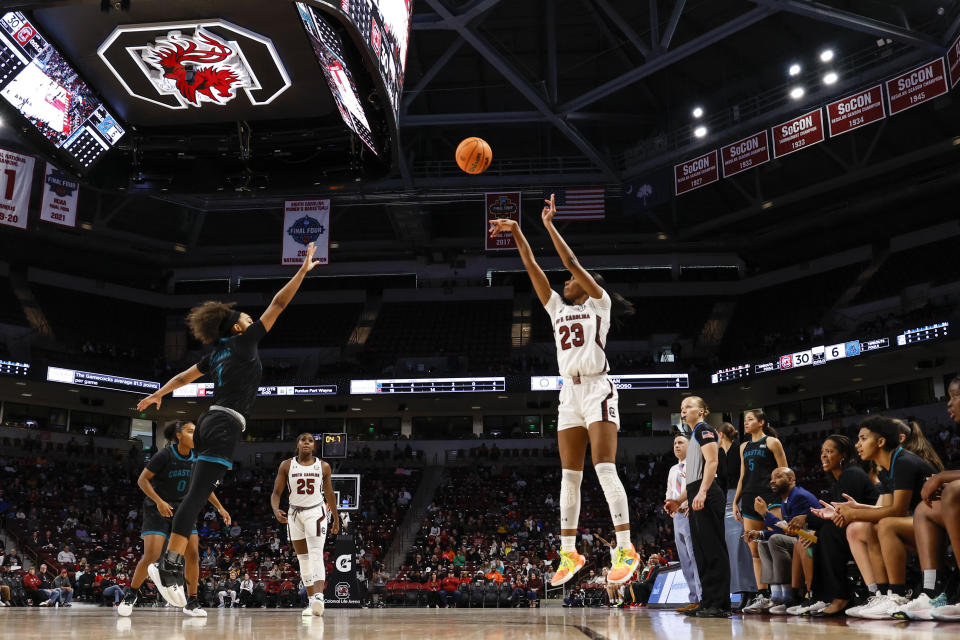 South Carolina guard Bree Hall (23) shoots over Coastal Carolina guard Brali Simmons (1) during the first half of an NCAA college basketball game in Columbia, S.C., Wednesday, Dec. 21, 2022. (AP Photo/Nell Redmond)