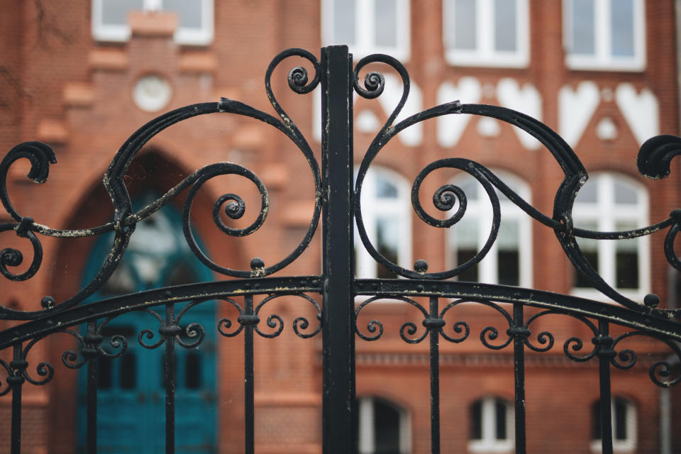 Gate of a residential building painted in black.