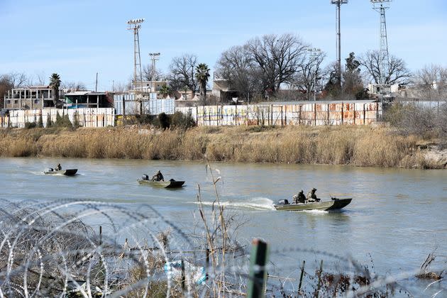 Texas National Guard troops patrol the Rio Grande after installing razor wire on the shores of Shelby Park in Eagle Pass, Texas, which is a top route for migrants crossing illegally from Mexico. The U.S. Supreme Court has allowed U.S. Border Patrol agents to remove the razor wire.