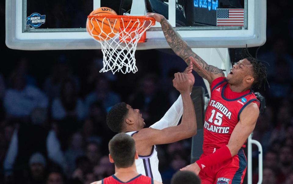 Florida Atlantic’s Alijah Martin dunks the ball over Kansas State’s David N’Guessan during the first half of their east region final game at Madison Square Garden on Saturday night.