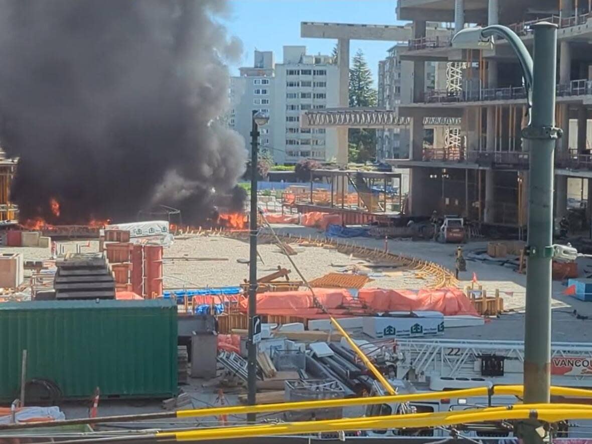 A fire at a construction site in the Oakridge area on June 3, 2023 sent a plume of black smoke into the Vancouver sky. (Mohammad Miri/Twitter - image credit)
