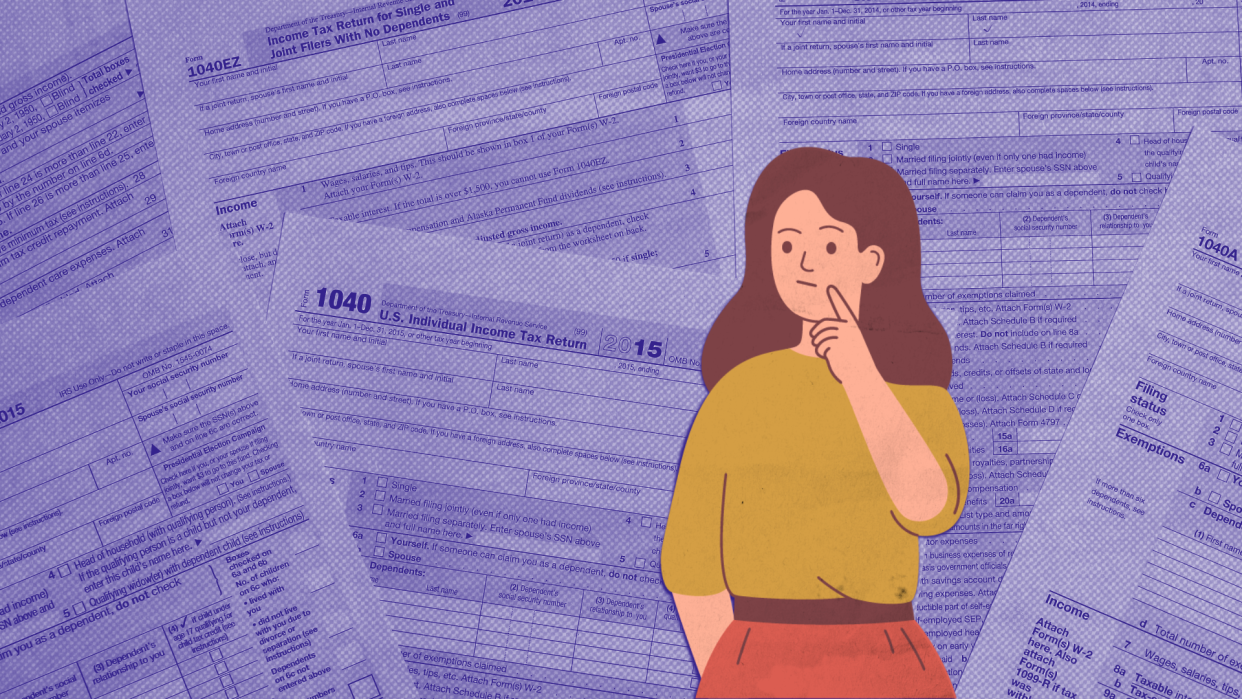 Woman standing in front of tax return forms