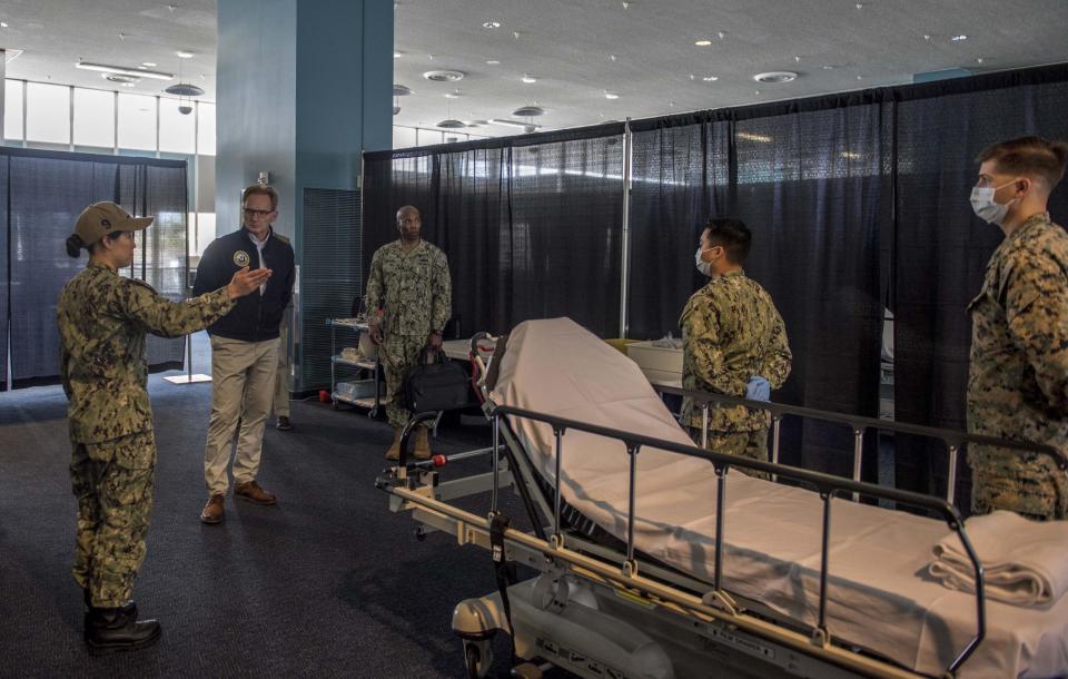 Acting navy secretary Thomas Moldy touring the ship after the removal of Capt Crozier (AP)