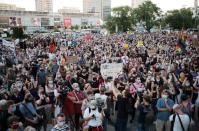 People take part in a rally in support of the LGBT community in Warsaw