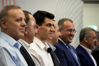 Popular YouTuber and TikToker with millions of online followers Fidias Panayiotou , third from left, stands with the others five elected, during his proclamation as the winner of one of six seats allotted to Cyprus in the European Parliament at the Filoxenia Conference Center in the capital Nicosia, Cyprus, on Tuesday, June 11, 2024. The 24-year-old Cypriot says he will continue using social media in his new job as a member of the European Parliament because he sees it as "my biggest weapon to use" in affecting the kind of change he wants to see on issues such as education. (AP Photo/Petros Karadjias)