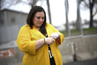Katie Wright holds the hand on her injured wrist before a news conference Thursday, May 5, 2022 outside the Brooklyn Center Police Station in Brooklyn Center, Minn. Katie Wright, the mother of Daunte Wright, said she was injured while she was briefly detained by one of the same department’s officers after she stopped to record an arrest of a person during a traffic stop. (Aaron Lavinsky /Star Tribune via AP)