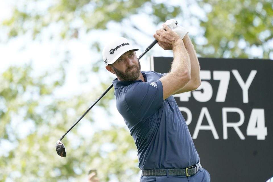 Dustin Johnson watches his tee shot on the fourth hole during the final round of the LIV Golf Invitational-Chicago tournament Sunday, Sept. 18, 2022, in Sugar Hill, Ill. (AP Photo/Charles Rex Arbogast)