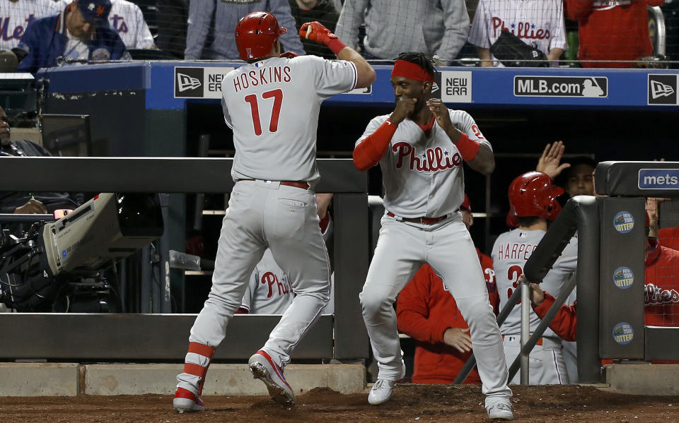 NEW YORK, NEW YORK - APRIL 24:   Rhys Hoskins #17 of the Philadelphia Phillies celebrates his ninth inning two run home run against the New York Mets with teammate Andrew McCutchen #22 of the Philadelphia Phillies at Citi Field on April 24, 2019 in New York City. (Photo by Jim McIsaac/Getty Images)