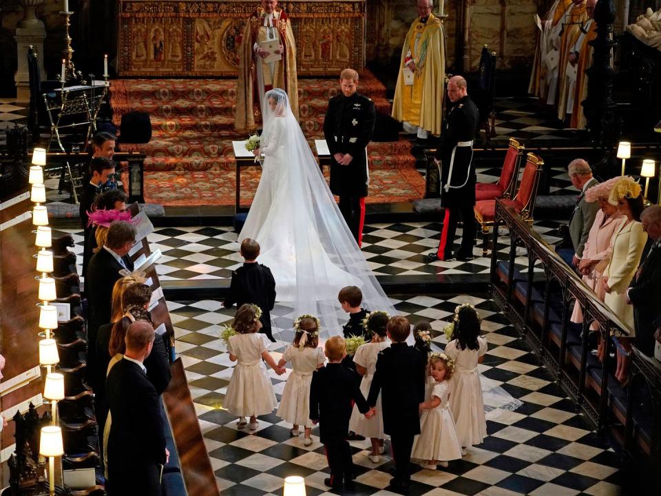 <p>Harry and Meghan smile at their adorable young bridal party as they prepare to say their vows.</p>