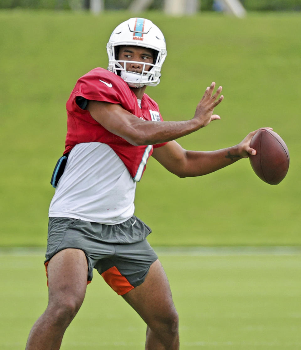 Miami Dolphins quarterback Tua Tagovailoa (1) sets up to pass during practice at Baptist Health Training Complex in Hard Rock Stadium on Wednesday, October 13, 2021 in Miami Gardens, Florida, in preparation for their game against the Jacksonville Jaguars at Tottenham Hotspur Stadium in London on Sunday, October 17.(David Santiago/Miami Herald via AP)