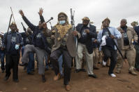 Zulu traditional men, sing and dance during a community and a local government campaign against Gender-Based Violence (GBV) and education on COVID-19, at a hostel in Katlehong, near Johannesburg, South Africa, Saturday, Nov. 28, 2020. (AP Photo/Themba Hadebe)