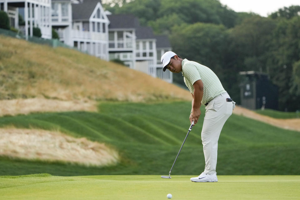 Tom Kim putts on the 12th green during the third round of the Travelers Championship golf tournament at TPC River Highlands, Saturday, June 22, 2024, in Cromwell, Conn. (AP Photo/Seth Wenig)