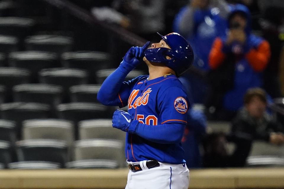 New York Mets' Francisco Alvarez (50) celebrates as he reaches home plate after hitting a home run during the sixth inning in the second baseball game of a doubleheader, Tuesday, Oct. 4, 2022, in New York. The Mets won 8-0. (AP Photo/Frank Franklin II)