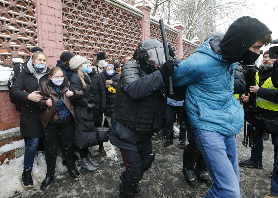 Police officers detain a man during a protest near the Matrosskaya Tishina prison where Alexei Navalny is being held, in Moscow, Russia, on Sunday, Jan. 31, 2021. Chanting slogans against President Vladimir Putin, thousands of people took to the streets Sunday across Russia's vast expanse to demand the release of jailed opposition leader Alexei Navalny, keeping up the nationwide protests that have rattled the Kremlin. Over 1,600 were detained by police, according to a monitoring group. (AP Photo/Alexander Zemlianichenko)