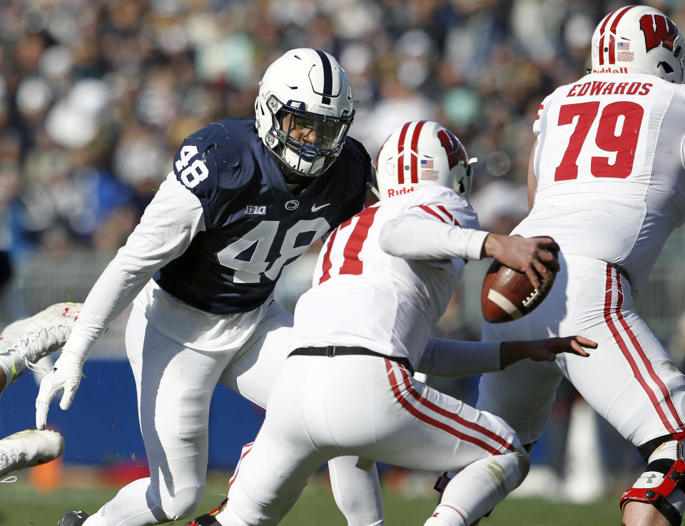 Penn State's Shareef Miller (48) moves in to sack Wisconsin quarterback Jack Coan (17) during the first half of an NCAA college football game in State College, Pa., Saturday, Nov. 10, 2018. (AP Photo/Chris Knight)