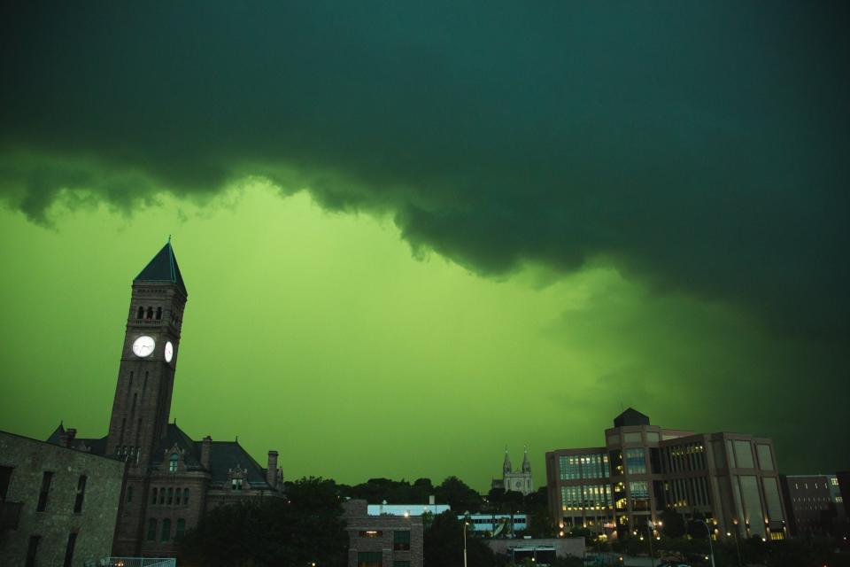 Skies in downtown Sioux Falls turn black and green as a powerful storm system moves across the area Tuesday afternoon, July 5, 2022. Winds reached more than 75 mph, according to the NWS.