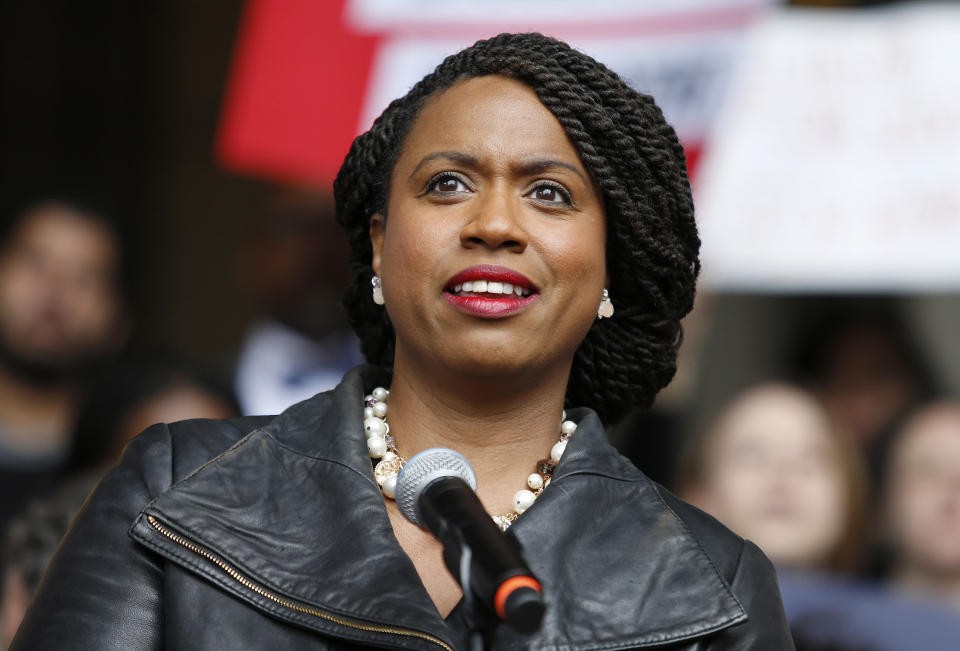 FILE - In this Oct. 1, 2018 file photo, Boston City Councilor Ayanna Pressley speaks at a rally at City Hall in Boston. Pressley, whose hair twists were an inspiration to young girls and part of her personal identity and political brand, revealed Thursday, Jan. 16, 2020, that she has gone bald due to alopecia. The freshman Massachusetts' Democrat made a touching video for The Root, the African American-focused online magazine, in which she revealed her bald head. (AP Photo/Mary Schwalm, File)