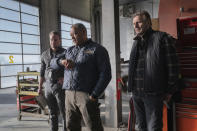 This image released by Netflix shows Marshall Williams, from left, Laurence Fishburne and Liam Neeson in a scene from "The Ice Road." (Allen Fraser/Netflix via AP)