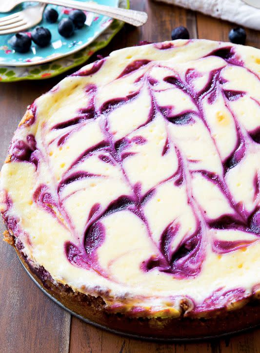 <strong>Get the <a href="http://sallysbakingaddiction.com/2014/06/24/blueberry-swirl-cheesecake/" target="_blank">Blueberry Swirl Cheesecake recipe</a> from Sally's Baking Addiction</strong>