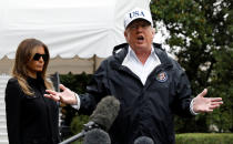 <p>President Donald Trump speaks to reporters as he and First Lady Melania Trump depart the White House in Washington on their way to view storm damage in Fla., Sept.14, 2017. (Photo: Kevin Lamarque/Reuters) </p>