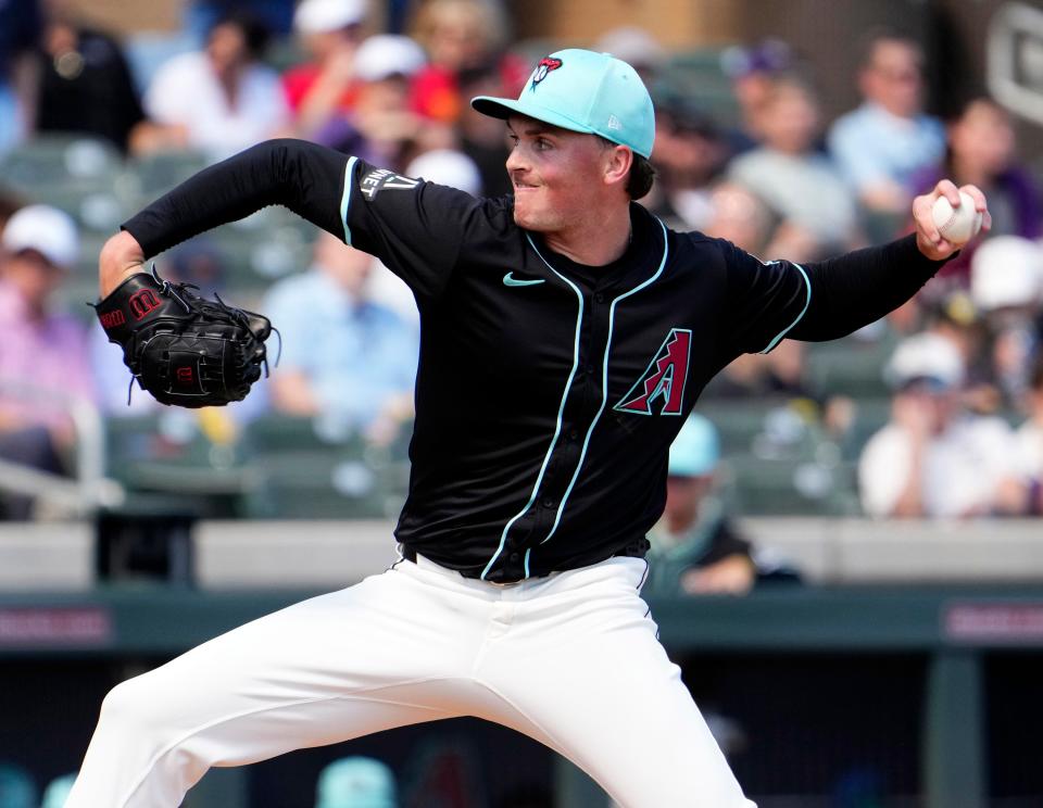 Arizona Diamondbacks starting pitcher Tommy Henry throws to the Kansas City Royals in the first inning during a spring training game at Salt River Fields in Scottsdale on March 14, 2024.