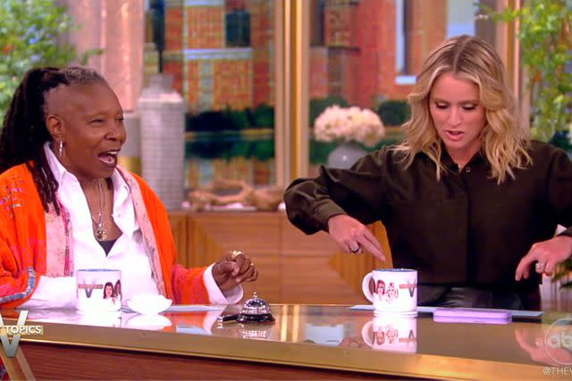 <p>ABC</p> Whoopi Goldberg looks at Sara Haines' skirt on 'The View'