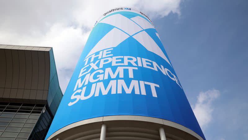 Signage is pictured for Qualtrics X4: The Experience Management Summit at the Salt Palace Convention Center in Salt Lake City, on Tuesday, March 7, 2023. The tech company announced Tuesday it is cutting its workforce by 15% amid restructuring.