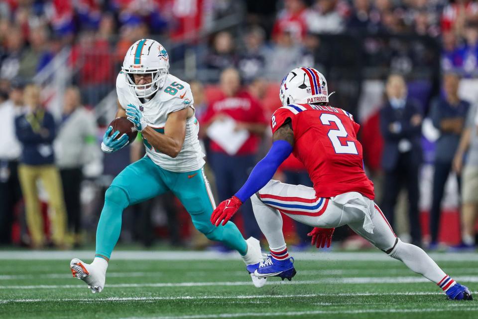 Sep 17, 2023; Foxborough, Massachusetts, USA; New England Patriots cornerback Jalen Mills (2) tackles Miami Dolphins receiver River Cracraft (85) during the first half at Gillette Stadium. Mandatory Credit: Paul Rutherford-USA TODAY Sports