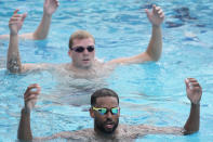 U.S. Olympic Water Polo Team attacker Max Irving, front, trains for the Paris Olympics, at Mt. San Antonio College in Walnut, Calif., on Wednesday, Jan. 17, 2024. Irving's father, Michael Irving, is a Pac-12 college basketball referee. Max Irving, a three-time All-American, is also the only Black man on the U.S. Olympic Water Polo Team and a prominent advocate for diversity in the sport. (AP Photo/Damian Dovarganes)
