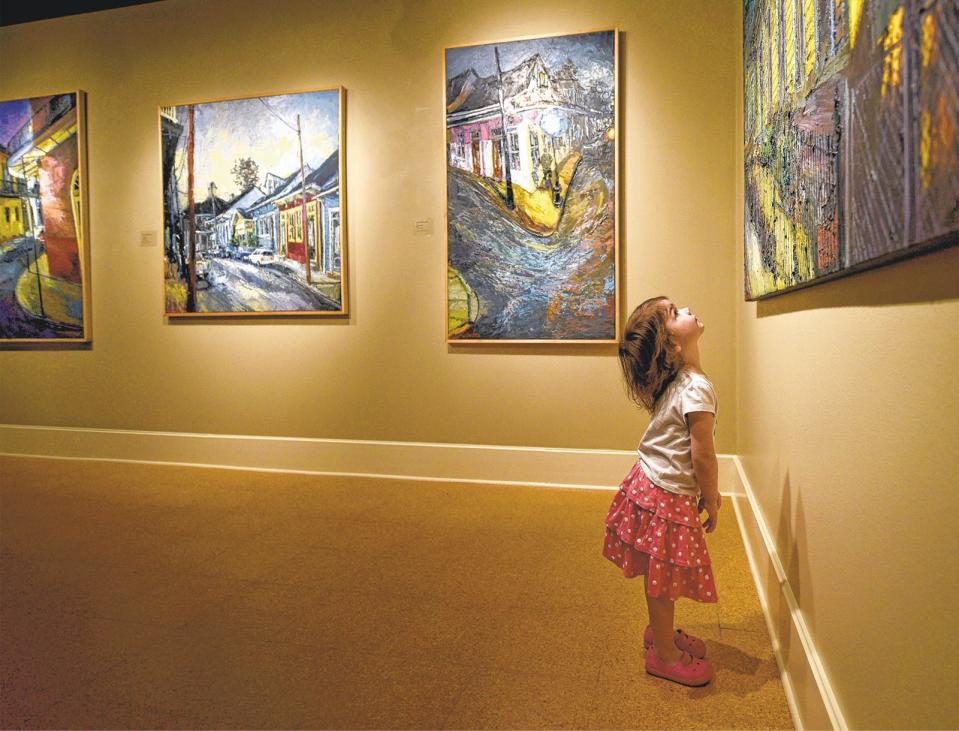 Mya VanDyke, then 2, checks out paintings by James Michalopoulos, which were on display as a special exhibition at the Morris Museum of Art in 2017.