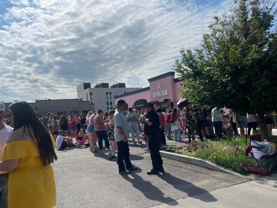 crowds of people outside of pink Jeffree Star building