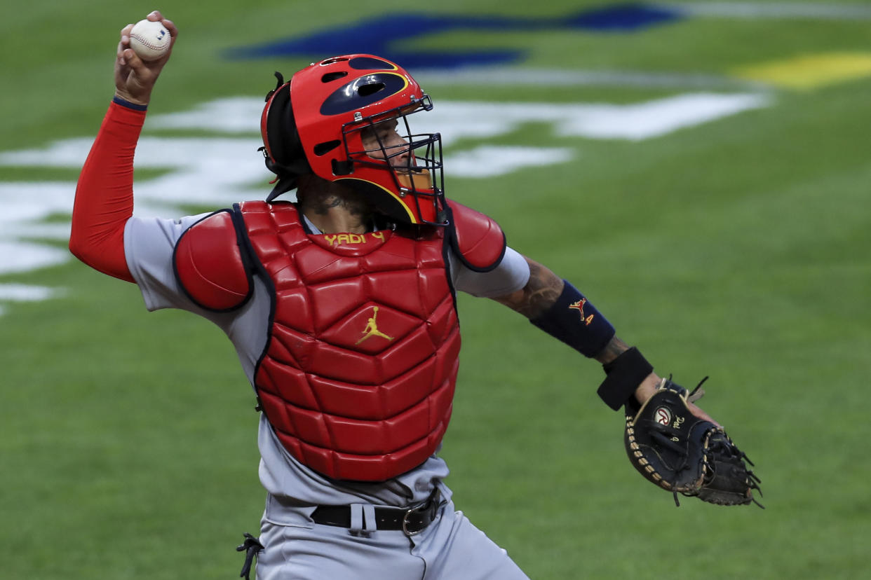 St. Louis Cardinals' Yadier Molina throws to second base during a baseball game against the Cincinnati Reds in Cincinnati, Monday, Aug. 31, 2020. The Cardinals won 7-5. (AP Photo/Aaron Doster)