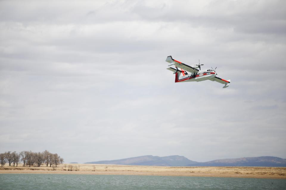 A super scooper provides aerial support for containment on the Black Fire in the Gila National Forest May 26, 2022.