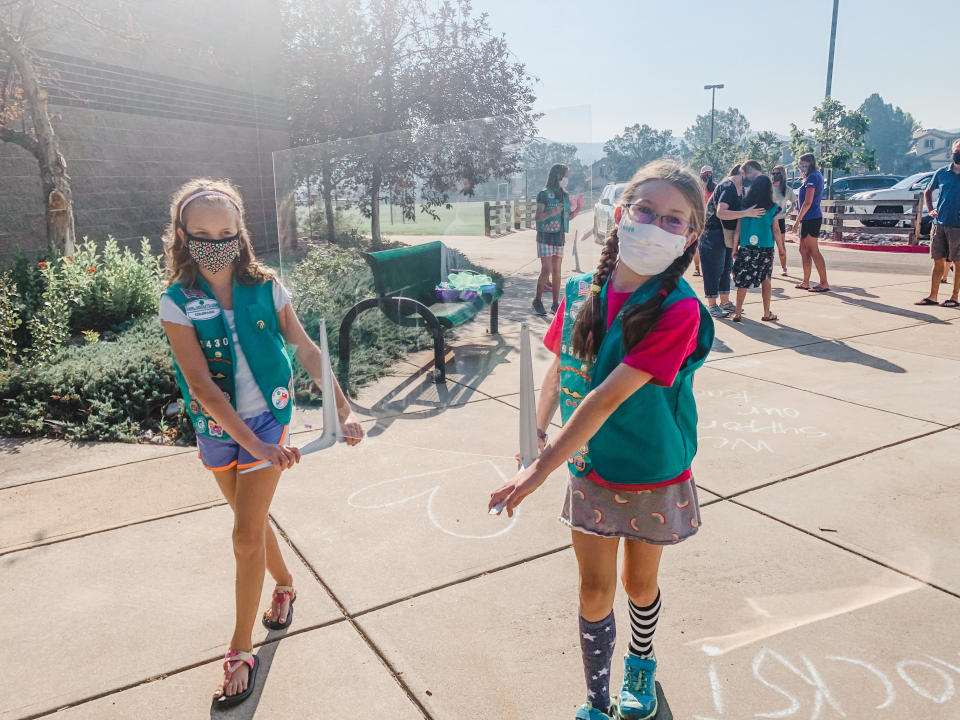 Members of Girl Scout Troop 65430 deliver PPE to their school. (Photo: Randi Bangertner)