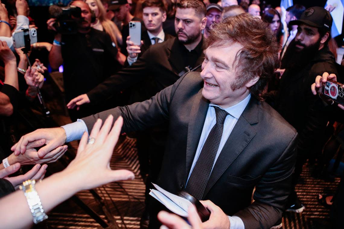Javier Milei, now president-elect of Argentina, shakes hands with supporters in Buenos Aires.