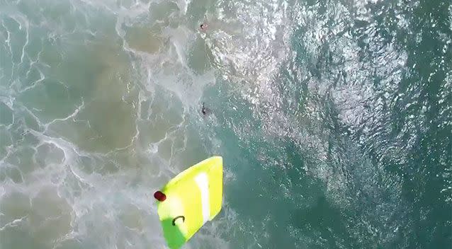 The drone drops the rescue pod into the water. Source: SLSNSW/Little Ripper Group/NSW DPI