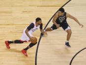 May 25, 2019; Toronto, Ontario, CAN; Toronto Raptors guard Norman Powell (24) drives to the net against Milwaukee Bucks guard Malcolm Brogdon (13) during the first half of game six of the Eastern conference finals of the 2019 NBA Playoffs at Scotiabank Arena. John E. Sokolowski-USA TODAY Sports