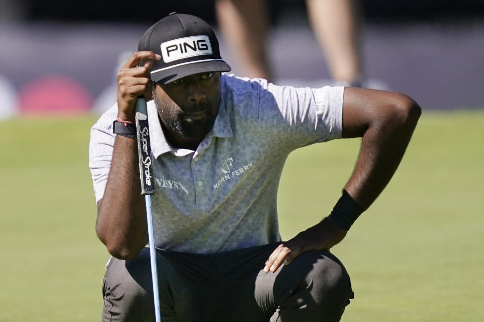 Sahith Theegala eyes his putt on the fourth green during the second round of the Rocket Mortgage Classic golf tournament, Friday, July 29, 2022, in Detroit. (AP Photo/Carlos Osorio)