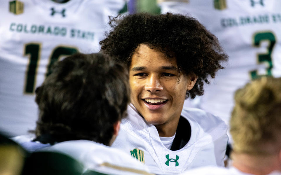 CSU football's freshman cornerback TJ Crandall smiles on the bench with his teammates after making a pass breakup to force fourth down against Wyoming at War Mermorial Stadium on Friday Nov. 3, 2023 in Laramie, Wyo.