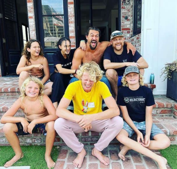 PHOTO: Travis Snyder, far right, poses with his friend actor Jason Momoa and family members. (Courtesy Travis Snyder)