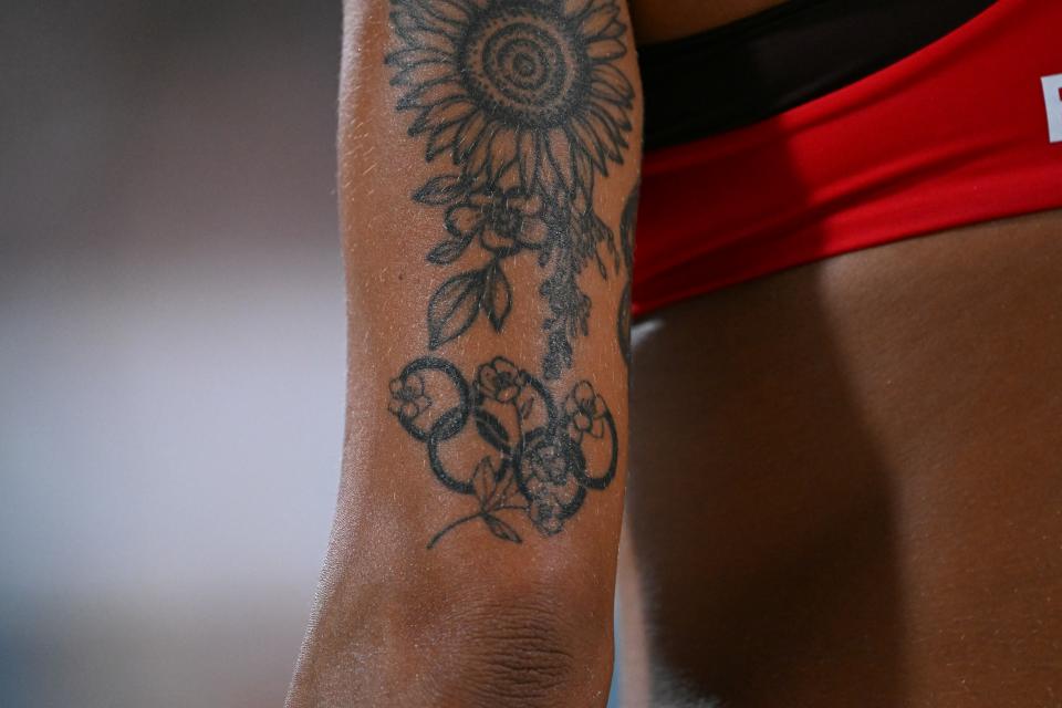 A close-up of the Olympic rings tattoo on the arm of Canadian beach volleyball player Brandie Wilkerson.