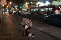 Anthony Delio, 36, falls asleep on a sidewalk after smoking fentanyl in Los Angeles, Tuesday, Aug. 23, 2022. Use of fentanyl, a powerful synthetic opioid that is cheap to produce and is often sold as is or laced in other drugs, has exploded. Because it's 50 times more potent than heroin, even a small dose can be fatal. It has quickly become the deadliest drug in the nation, according to the Drug Enforcement Administration. Two-thirds of the 107,000 overdose deaths in 2021 were attributed to synthetic opioids like fentanyl, the U.S. Centers for Disease Control and Prevention says. (AP Photo/Jae C. Hong)