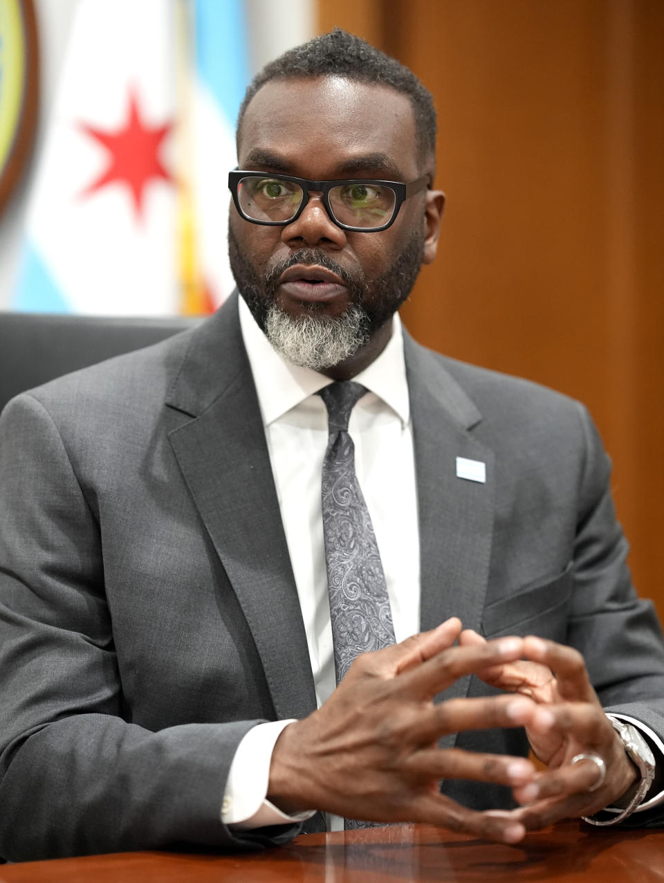 Chicago Mayor Brandon Johnson responds to a question in his City Hall office during an interview with The Associated Press Monday, May 6, 2024, in Chicago. The rookie mayor's bumpy first year has been a test of his progressive credentials. He's navigated an evolving migrant crisis, budget gaps, persistent crime and a troubled transit system to name a few. While there have been wins for workers and social services, he's struggled with businesses, police and fellow Democrats. (AP Photo/Charles Rex Arbogast)