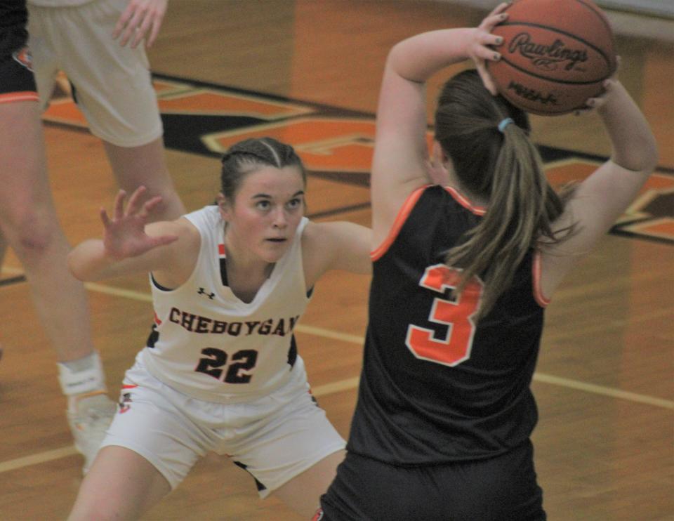 Cheboygan sophomore Olivia Patrick (22) defends Newberry's Allie Whalen (3) during the first half of Tuesday's girls basketball contest in Cheboygan.