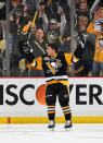 <p>Pittsburgh's Conor Sheary combined with Sidney Crosby - who had a four-point night — to score the winner 34 seconds into overtime to defeat Washington 8-7. What a game. (Getty Images) </p>