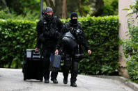 Investigators are seen during a police operation in Oullins, near Lyon, France May 27, 2019. REUTERS/Emmanuel Foudrot